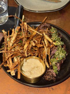 Steak & frites served on an appetizer plate (super thin shoestring fries)