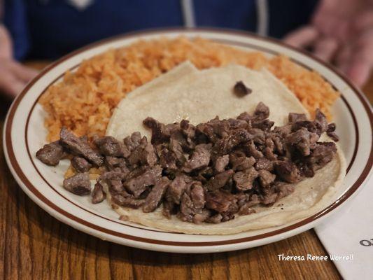 Kids plate all rice with Carne Asada taco