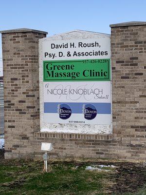 Picture of the marquee by the side of the road with our big green sign.