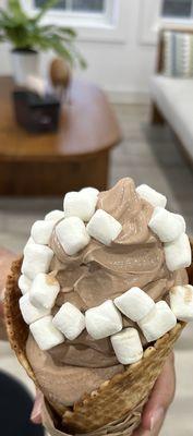Chocolate banana with marshmallows in waffle cone