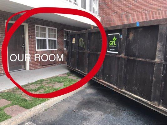 View of how close they dropped this dumpster without notice at 8am one morning waking me up in a complete panic thinking a bomb went off.