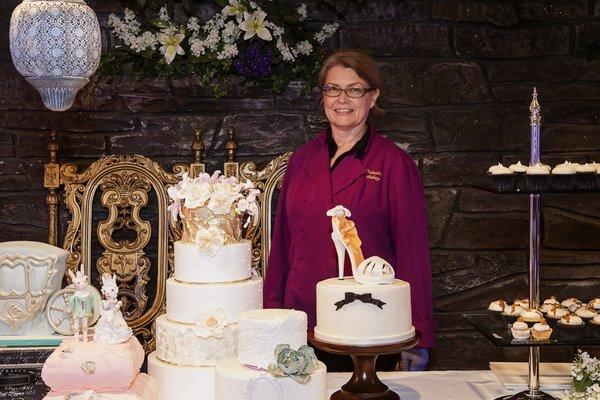 The Babushka Bakery Chef admiring some of her creations