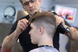 Our stylist, Joseph, cuts one of our regular customers. Loving Martin's new look!