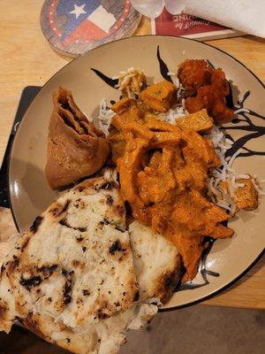 Tasty but a bit spicy: butter garlic naan, veggie samosa, butter chicken, Gobi 65, and chicken Tikka masala. 5.16.22