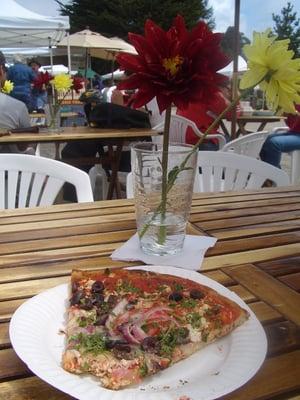 eating a slice at Westside Farmer's Market