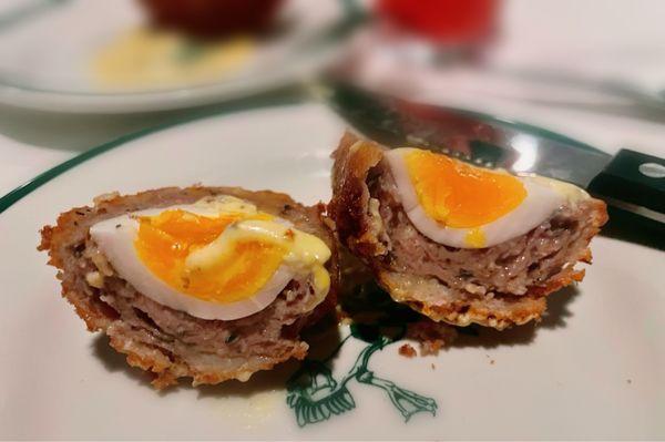 Cross section look at half of the scotch egg.