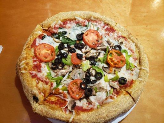 Veg Out made vegan with Follow your heart cheese and no butter and parmesan on the crust