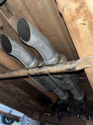Mufflers with turndown tips