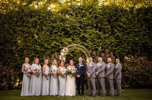 Outdoor ceremony area with wrought iron arch