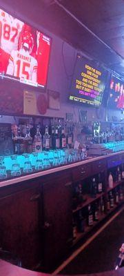 Bar, with karaoke screen and sports game.