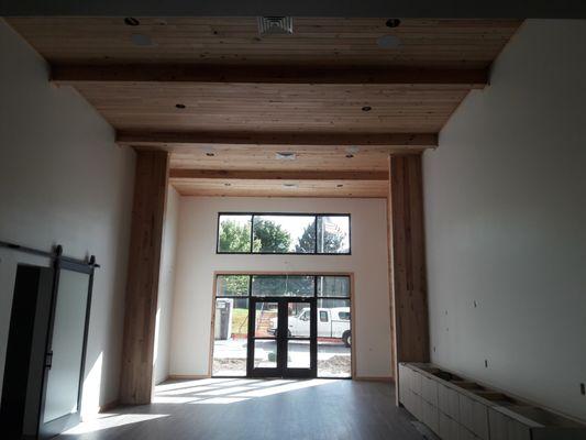 Pool House installed wood flooring on the ceiling and walls