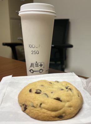 Large coffee with chocolate chip cookie.