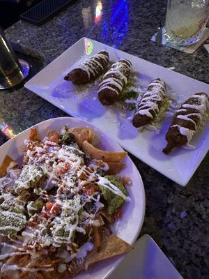 Chicken nachos and stuffed jalapeños