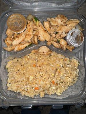 Chicken with fried rice and vegetables.