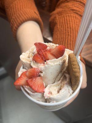 Strawberry cheesecake rolled ice cream with strawberry and lotus cookie as toppings