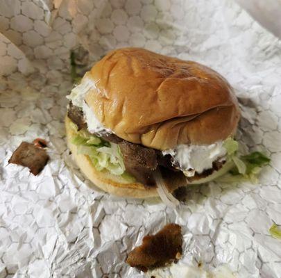 Spicy gyro chicken sandwich with added onion and Swiss cheese.