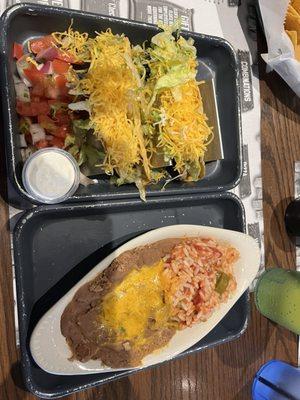 Shredded beef tacos, beans, rice.