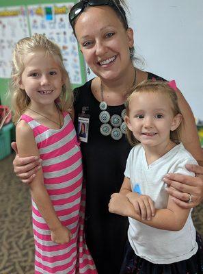 Miss Mala, the director, with a previously graduated student and her incoming little sister