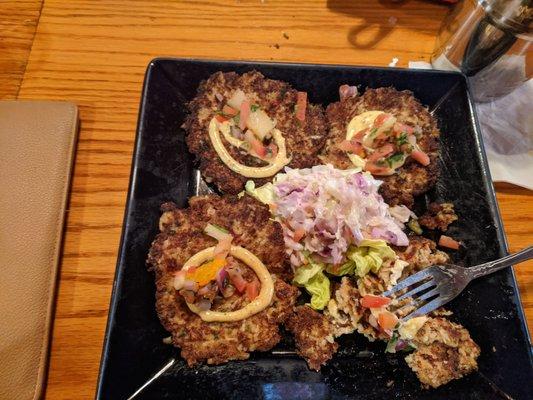 Extremely thin crab cakes served with very warm Cole slaw.