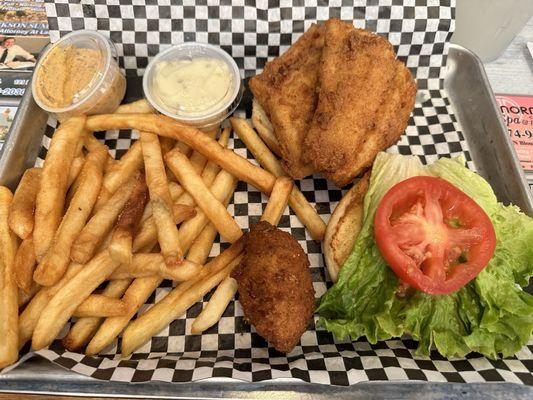 Fried grouper sandwich, fries and a hush puppy