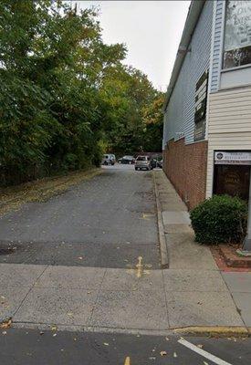 Entrance and driveway to parking lot in the back.