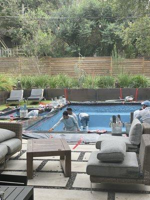 The crew applying the hydrazzo material