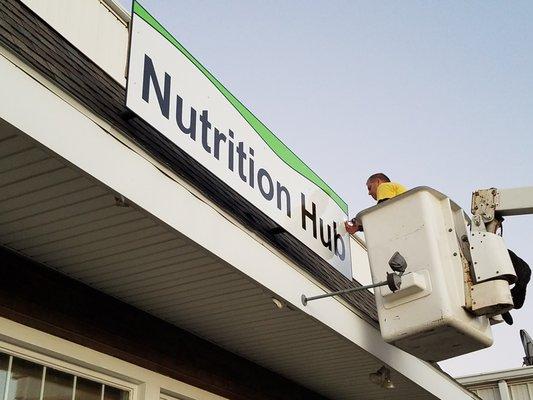 Nutrition Hub building sign nearly installed
