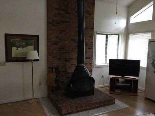 Wood stove in nice vaulted living room