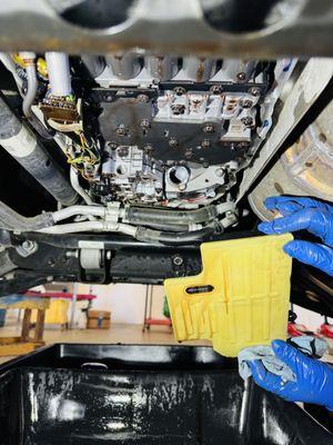 Changing transmission fluid involves draining the old fluid, replacing the filter, and refilling with fresh fluid.