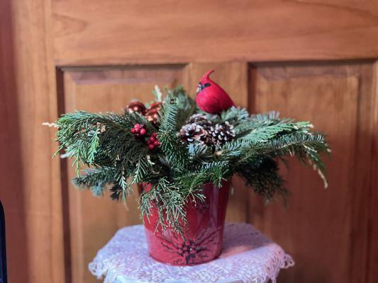 Holiday poinsettia tin with cardinal