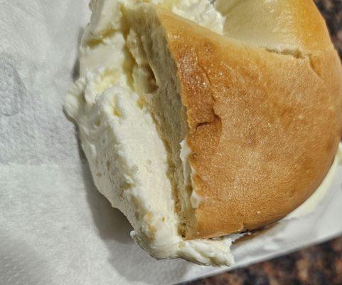 I'm not a cream cheese expert.. But this is either old cream cheese or not Philadelphia