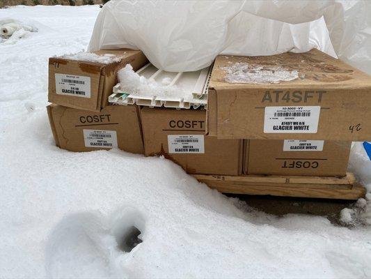 Pile of siding/soffit that sat in our driveway for 6+ months - it was the wrong color.