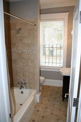 Quick-turn, retiled floor and tub surround, installed new sink, repainted and installed new lighting and blinds.