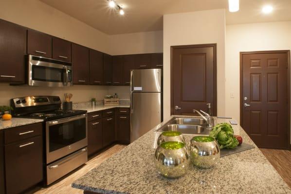 Granite counter tops and stainless steel appliances are standard features at Urban Crest.
