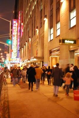 Corner of 6th Ave & 49th Street. Street view, go one level down where the subway the sign is.