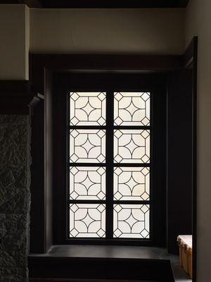 Decorative glass in family dining room to provide privacy while allowing natural light in