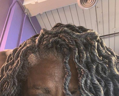 I had my hair washed and blow dried, braided in cornrows, then added crochet locs! It was perfect afternoon!