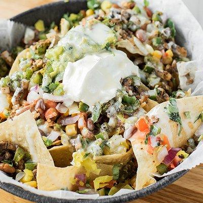 Loaded Surcheros Nachos covered in White Cheese Dip