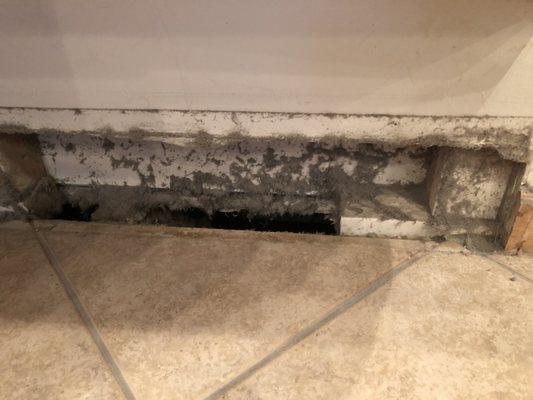 Cleaning out a cold air return.