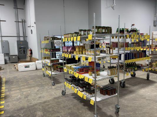 Racks in the warehouse with mustard ketchup and pickles