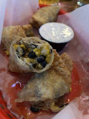 Egg rolls. Made to order. Got a little soggy from the fresh ingredients, but's tasty.