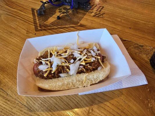 Cony dog with onions and shredded cheese