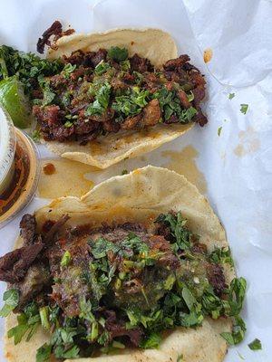 Pastor and cabeza tacos with hands made tortillas.