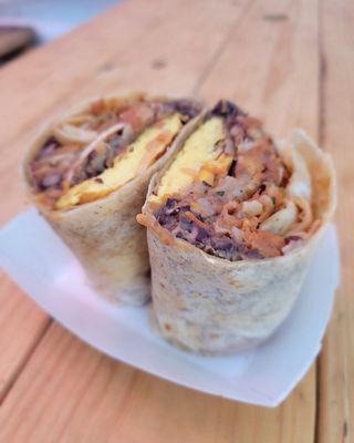 Breakfast Burrito - egg, crispy bakon, black beans, hash-brown mittens, home made salsa, cheese all wrapped in a big tortilla for 12$.