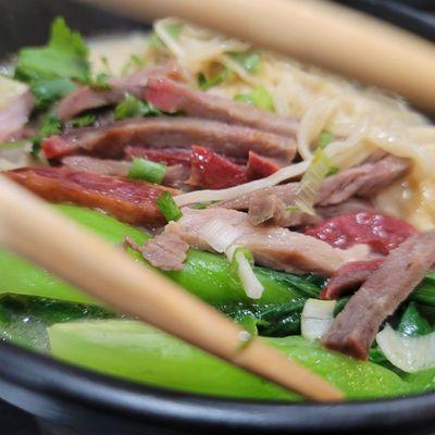 Beef, dumpling noodle soup