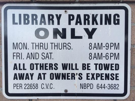 There is a small parking lot behind the library with a handful of spaces where you can park for free!