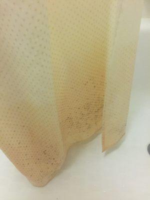 Stained and molded shower curtain