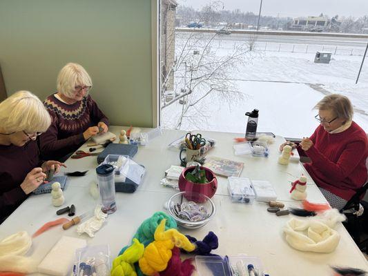 Working hard on needle felted snowmen