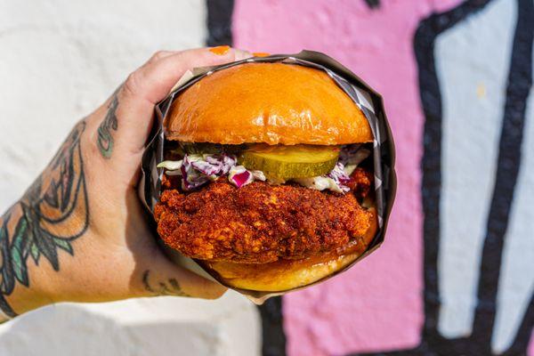 The Birdman - Hot Fried Chicken Thigh, Kimchi Comeback Sauce, Tangy Slaw, Sweet & Spicy Pickles, Potato Brioche Bun (Photo: Kimberly Motos)