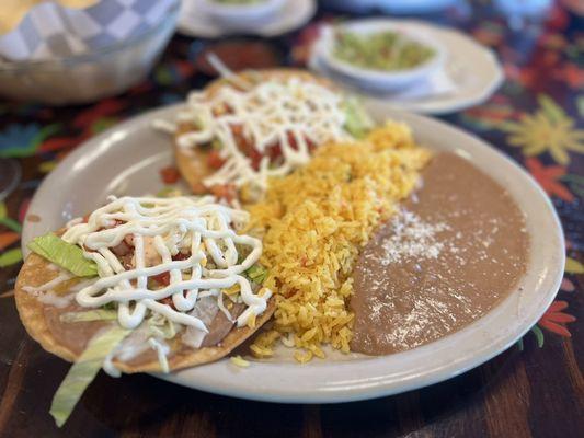Vegetarian plate with rice, beans, and two tostadas